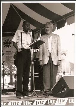 Rocky Adcock presenting the first Sylvester Weaver Award to Henry Woodruff at the 1989 Garvin Gate Blues Festival. Photo by Keith Clements